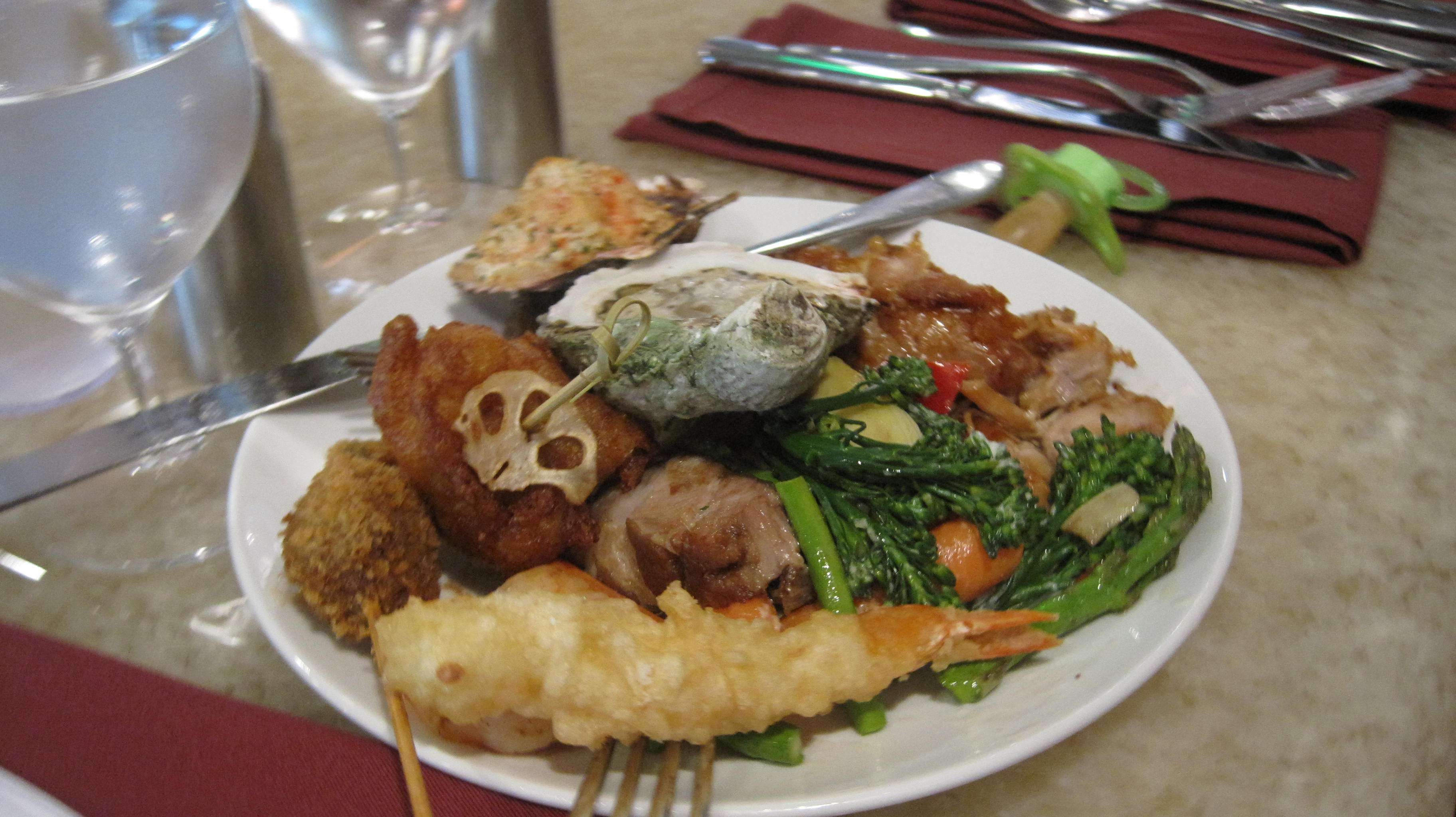 Loaded plate with tempura shrimp and local favorites