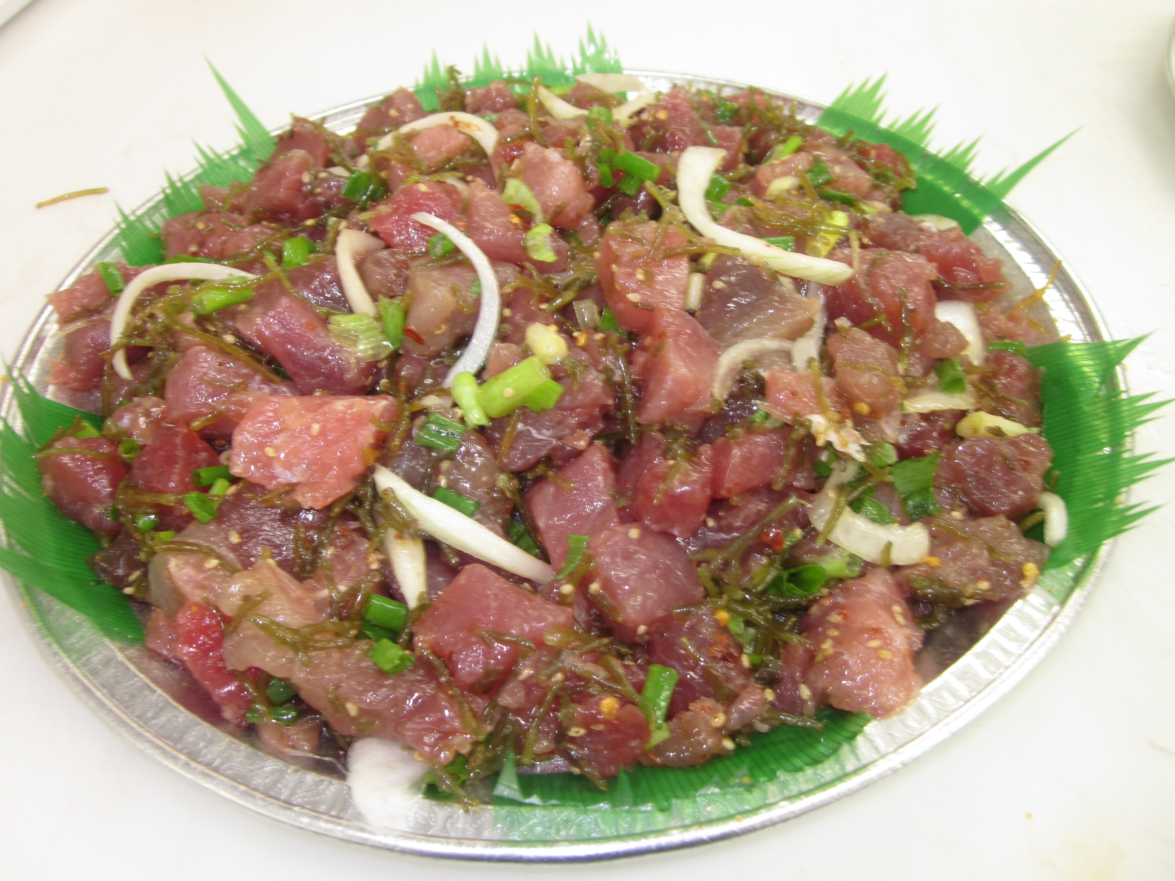 Fresh limu ahi poke platter on ti leaf