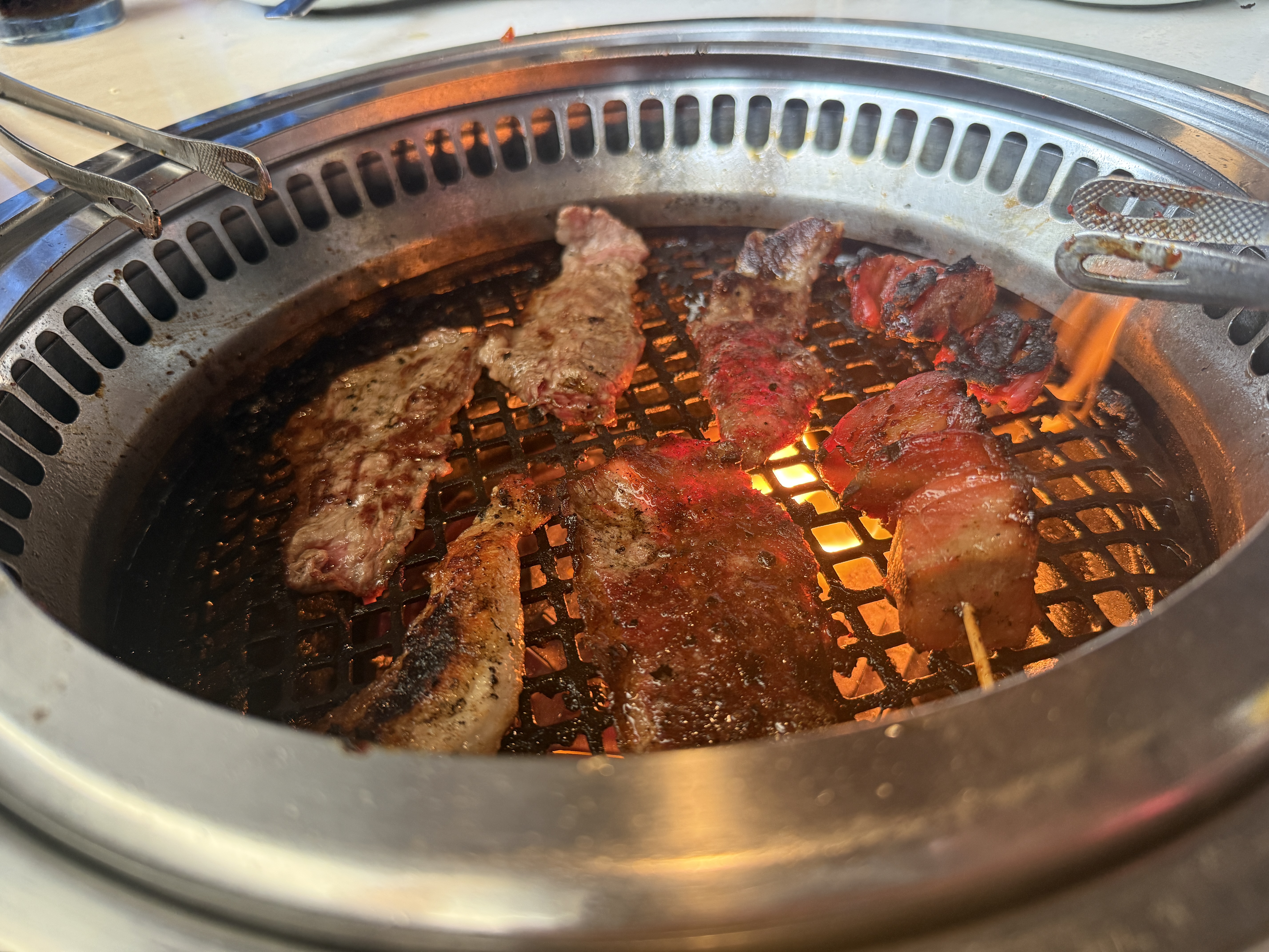 Korean BBQ meat sizzling on the grill